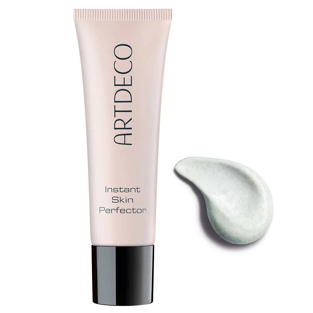 Tube de produit et goutte. Inscription ARTDECO, Instant Skin Perfector. Tube rose, bouchon noir. Goutte vert clair.