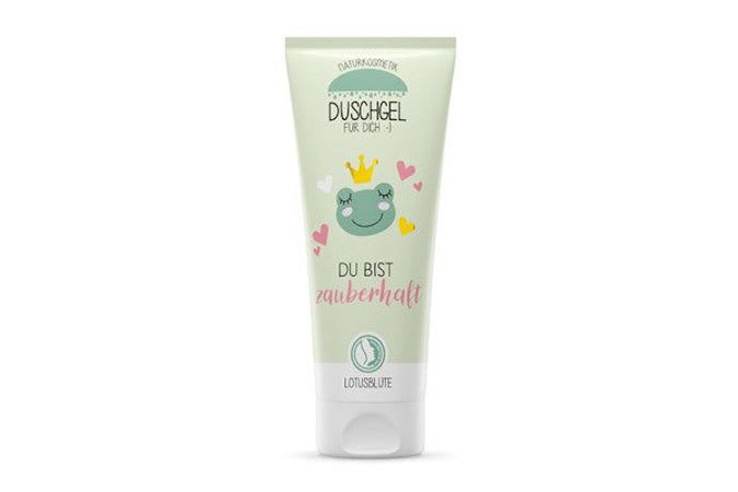 Tube de gel douche vert clair avec illustration de grenouille et inscription "Du bist zauberhaft". Logo "Lotusblüte" en bas.