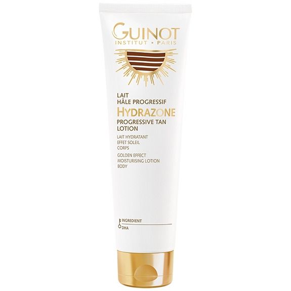 Witte tube met gouden dop. Opschrift: Guinot, Hydrazone, Progressive Tan Lotion. Zonne-motief.
