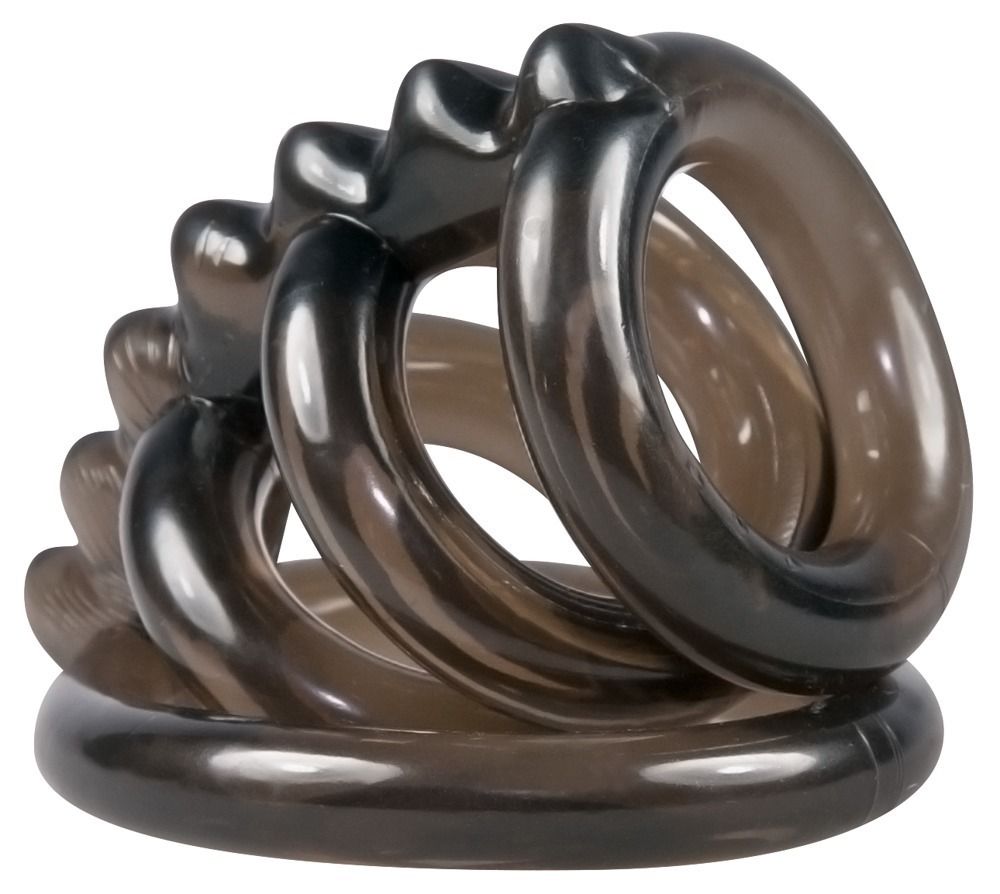 Zwarte cockring-set met ballenring. Meerdere ringen, spiraalvormig gerangschikt. Transparante, donkere kleur. Van rubber of siliconen.