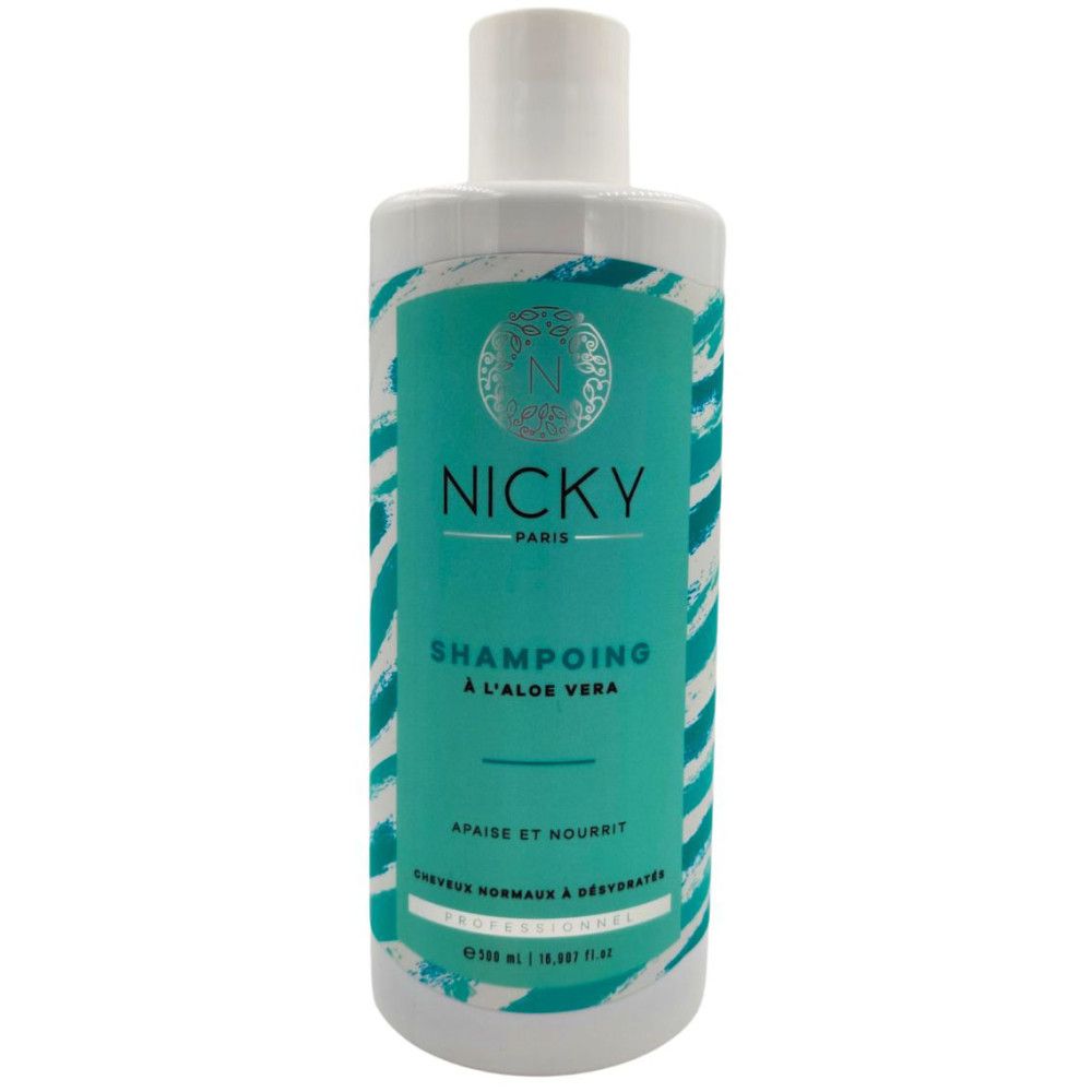 Shampoo fles. Opschrift: Nicky Paris, Shampoo à l'aloe vera. Turquoise en wit design. Voor normaal en uitgedroogd haar.