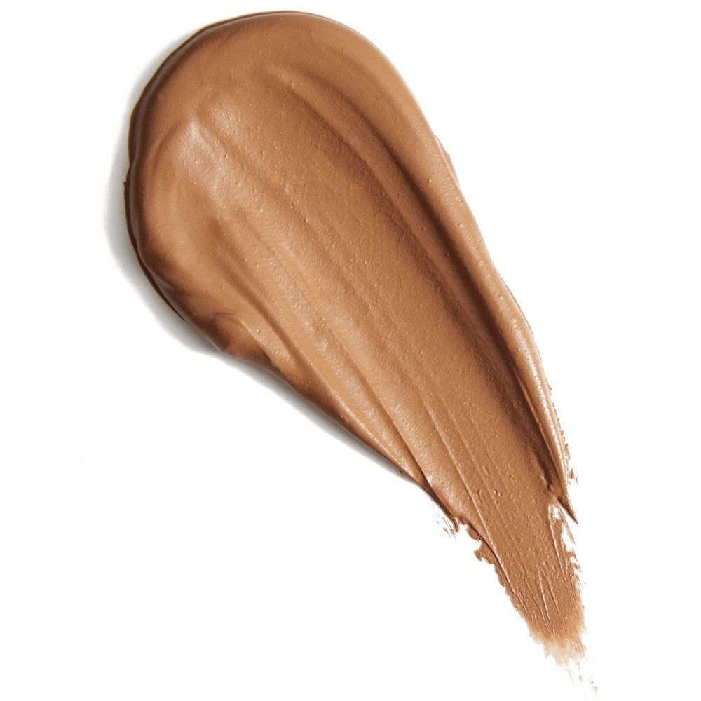 Échantillon de correcteur brun. Texture visible. Sur fond clair.