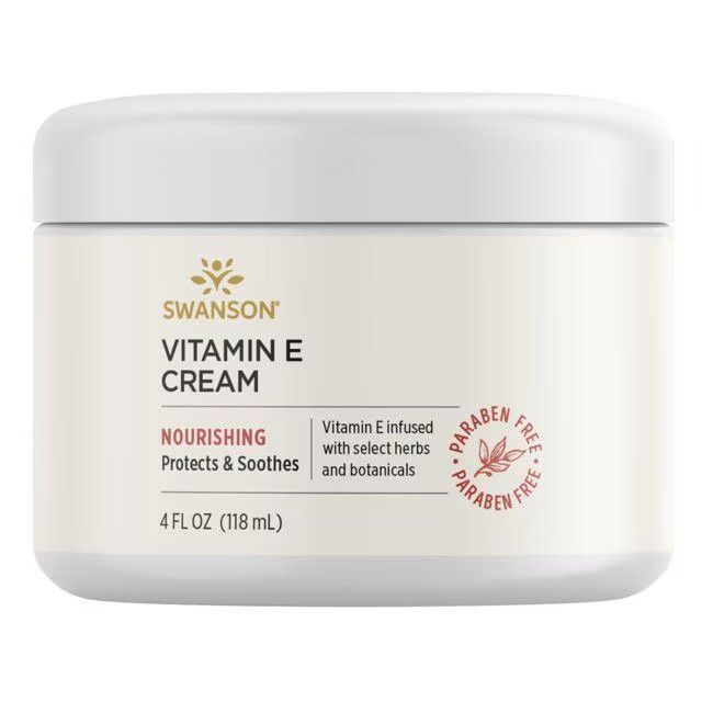 Pot blanc avec inscription SWANSON Vitamin E CREAM. Contient 4 FL OZ (118 mL). Texte : Nourishing, Protects & Soothes. Sans parabène.