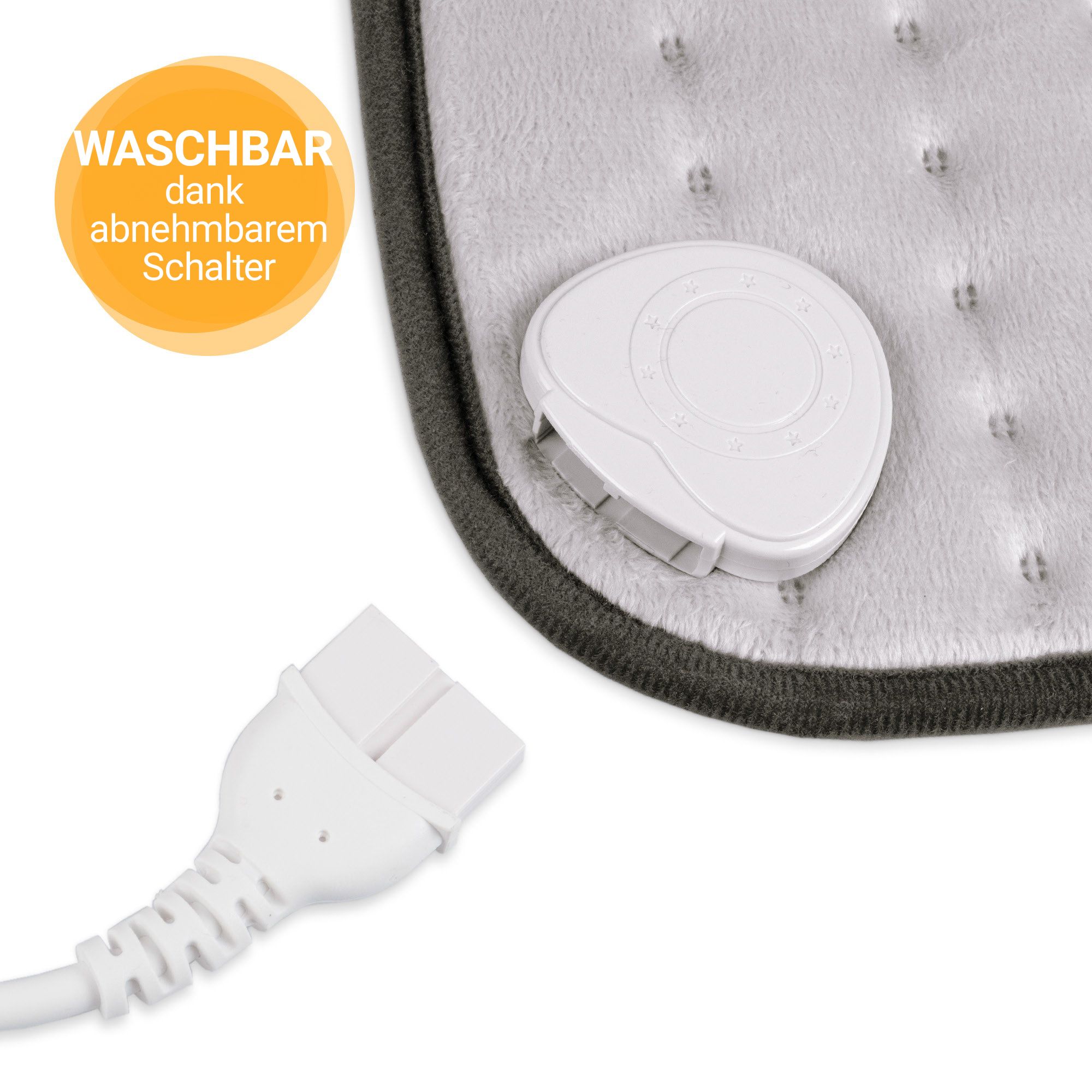 Gros plan : interrupteur amovible et prise d'un coussin chauffant gris.