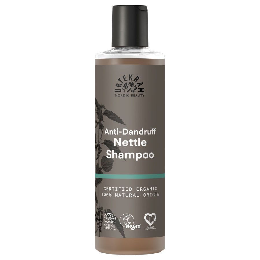 Bruine fles met zwarte dop. Opschrift: Anti-roos Nettle Shampoo. Gecertificeerd biologisch product.