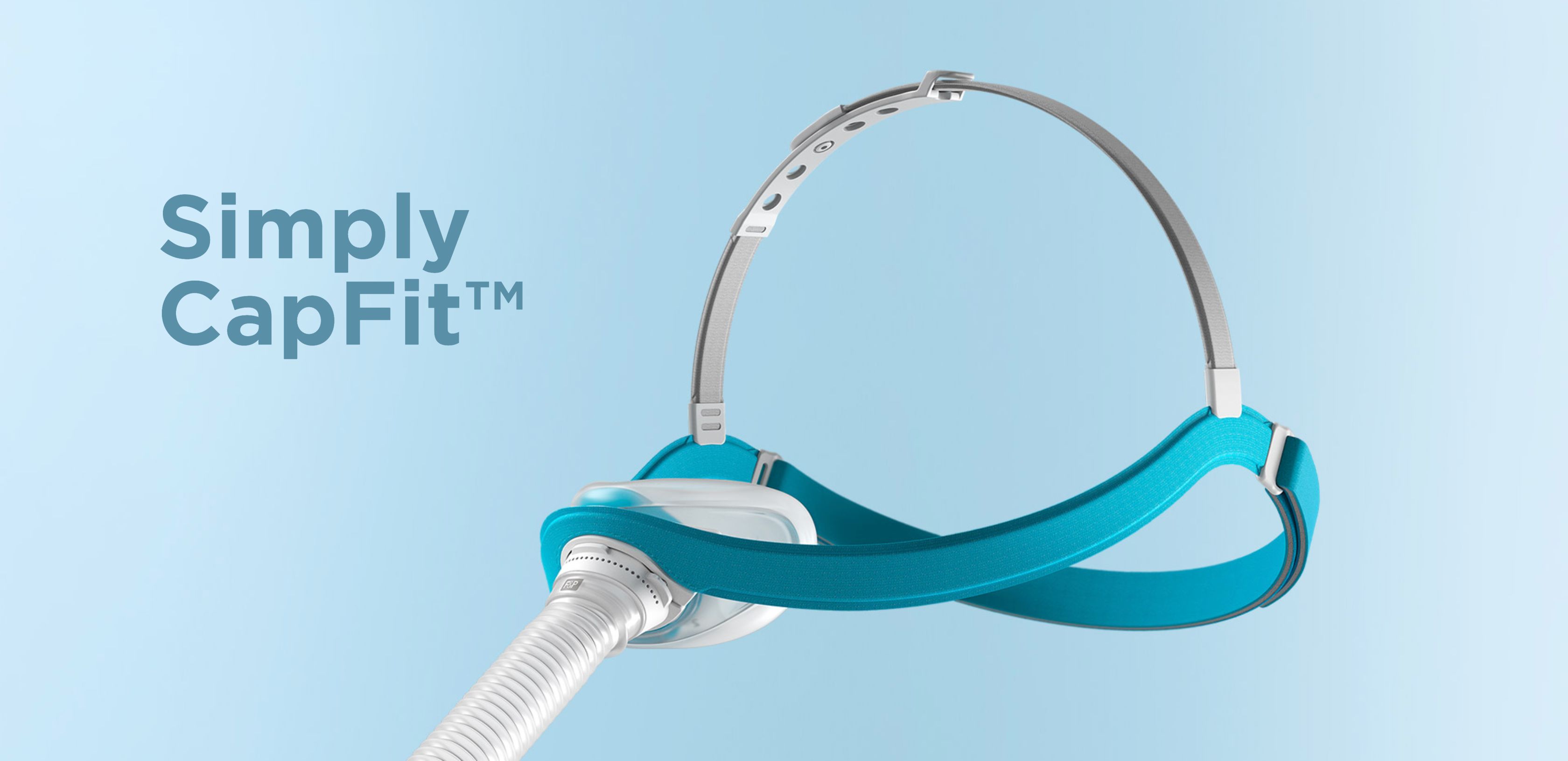 Masque nasal avec bandeau bleu et tube blanc. Texte : Simply CapFit™. Fond bleu.