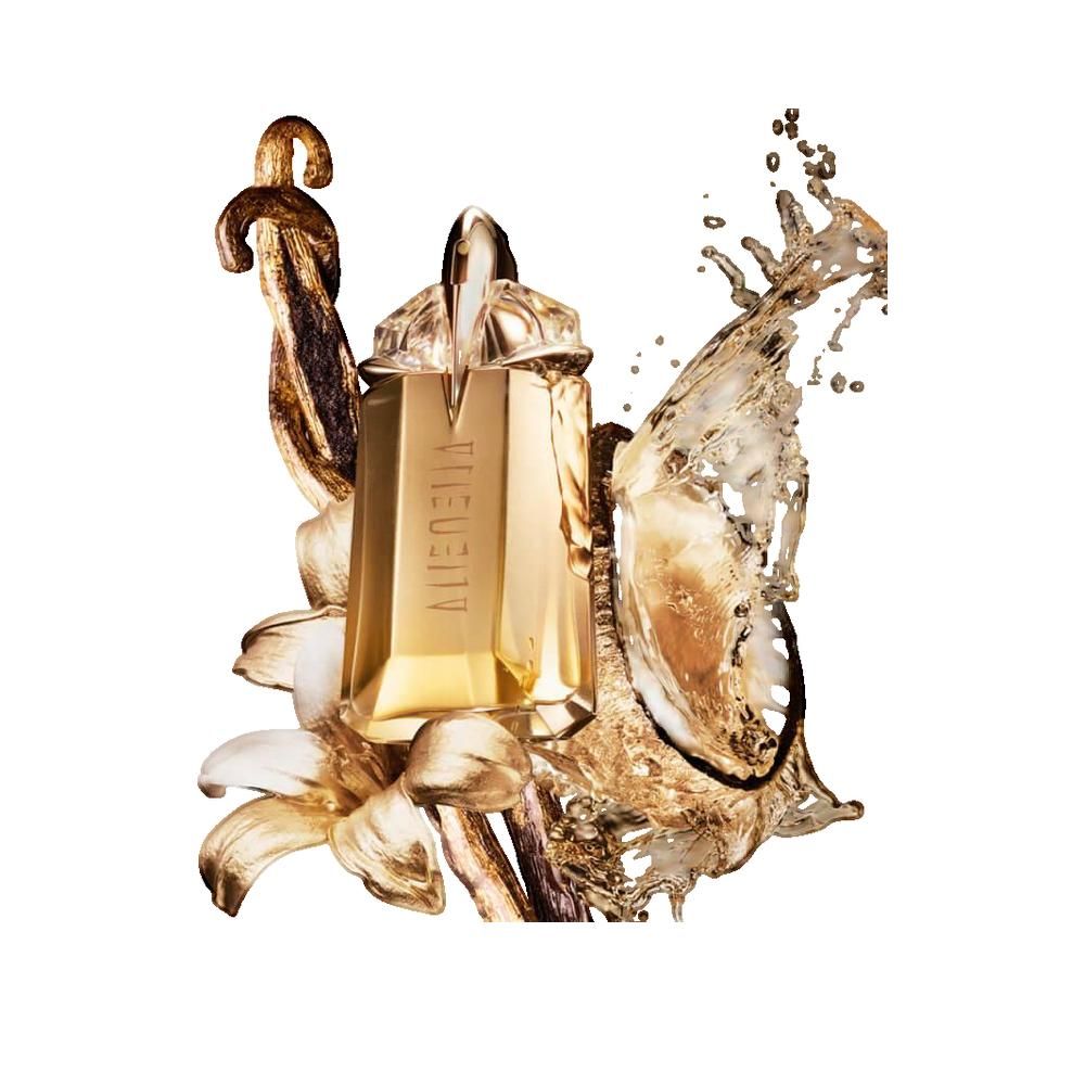 Flacon doré Alien, lettrage visible. Décor floral et éclaboussures de liquide.