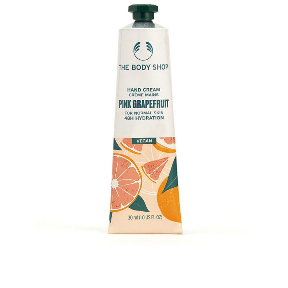 Handcrèmetube. Wit, met groene dop. Opschrift: Pink Grapefruit, Vegan. Illustraties van grapefruit. Merk: The Body Shop.