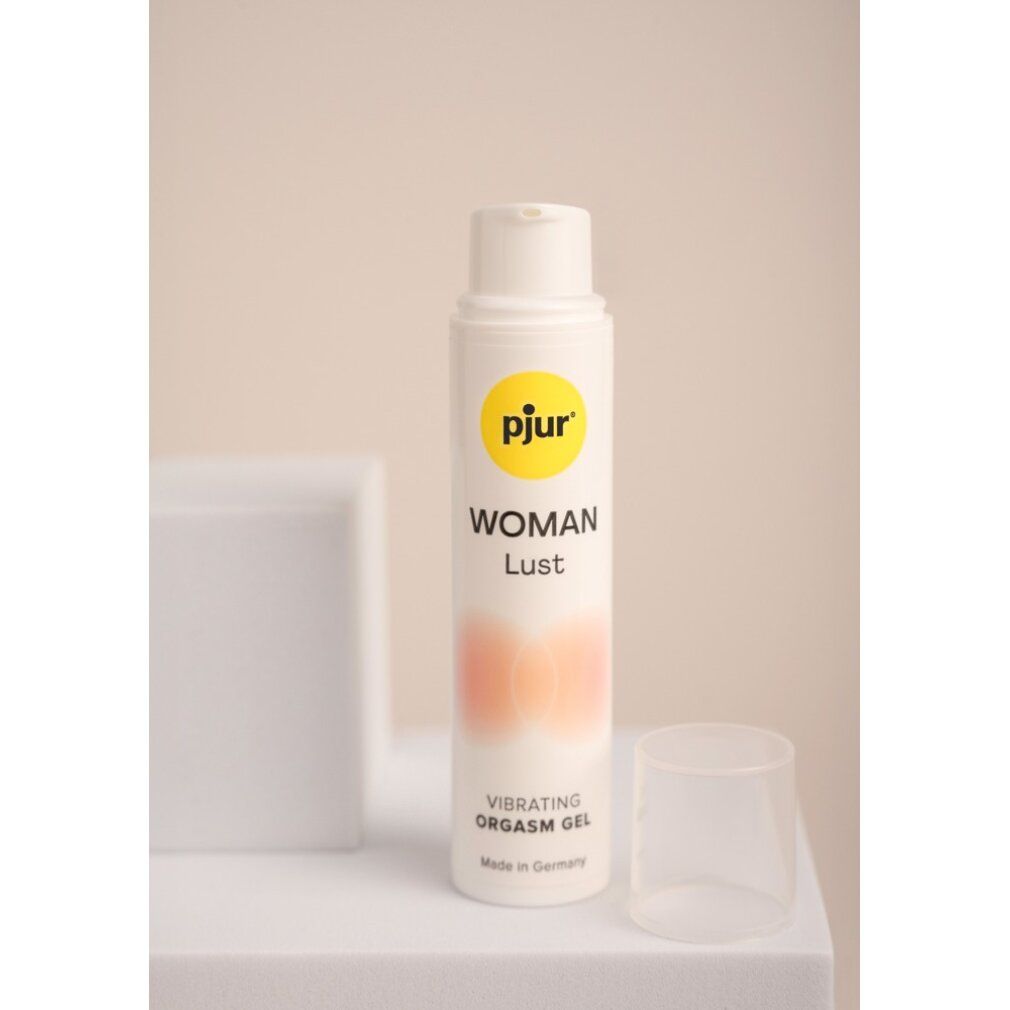 Flacon blanc avec étiquette jaune. Nom et texte du produit. Bouchon transparent. Texte : Vibrating Orgasm Gel. Fabriqué en Allemagne.