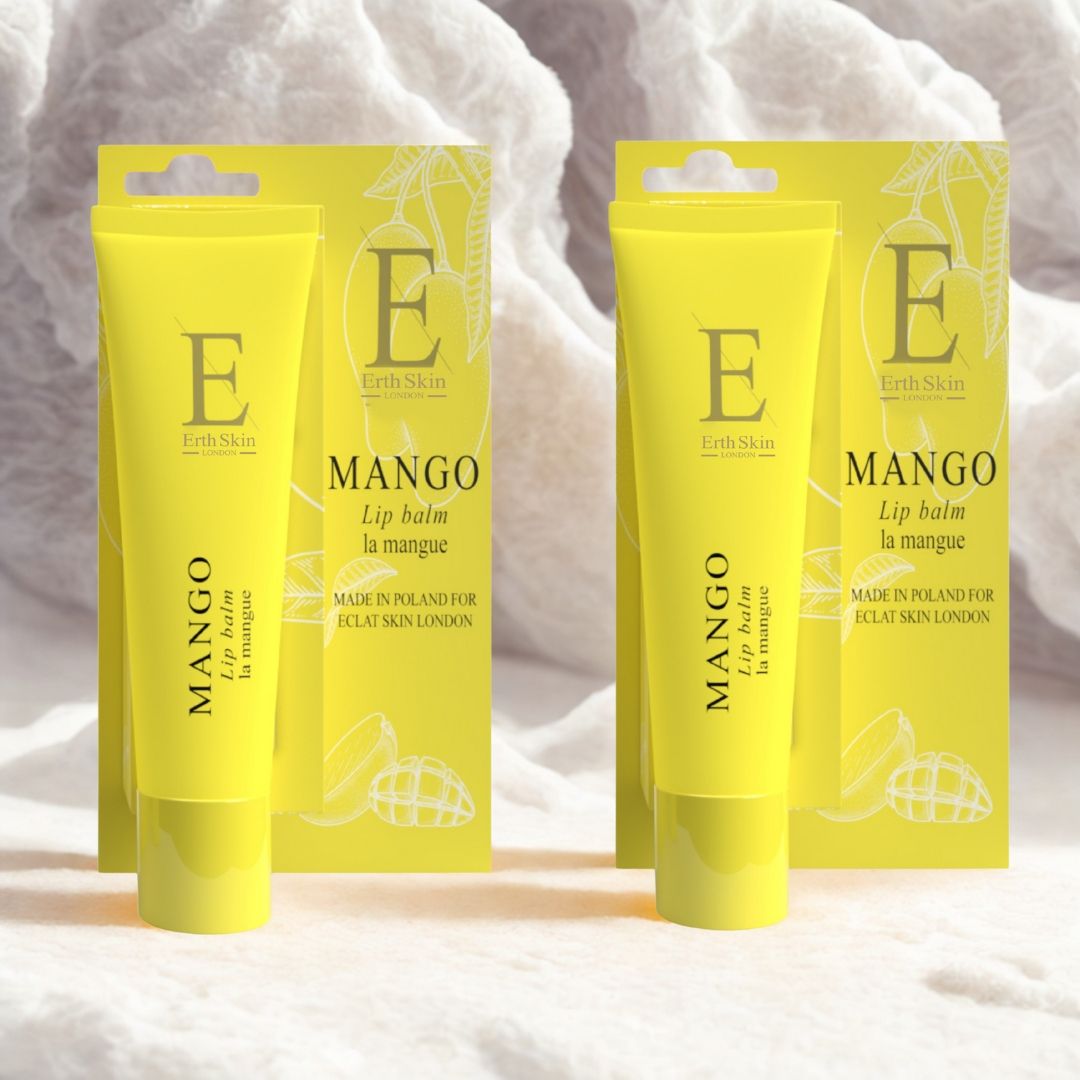 Twee gele lippenbalsemtubes met verpakking. Opschrift: Mango, Eclat Skin London. Gele verpakking met mango-illustratie.