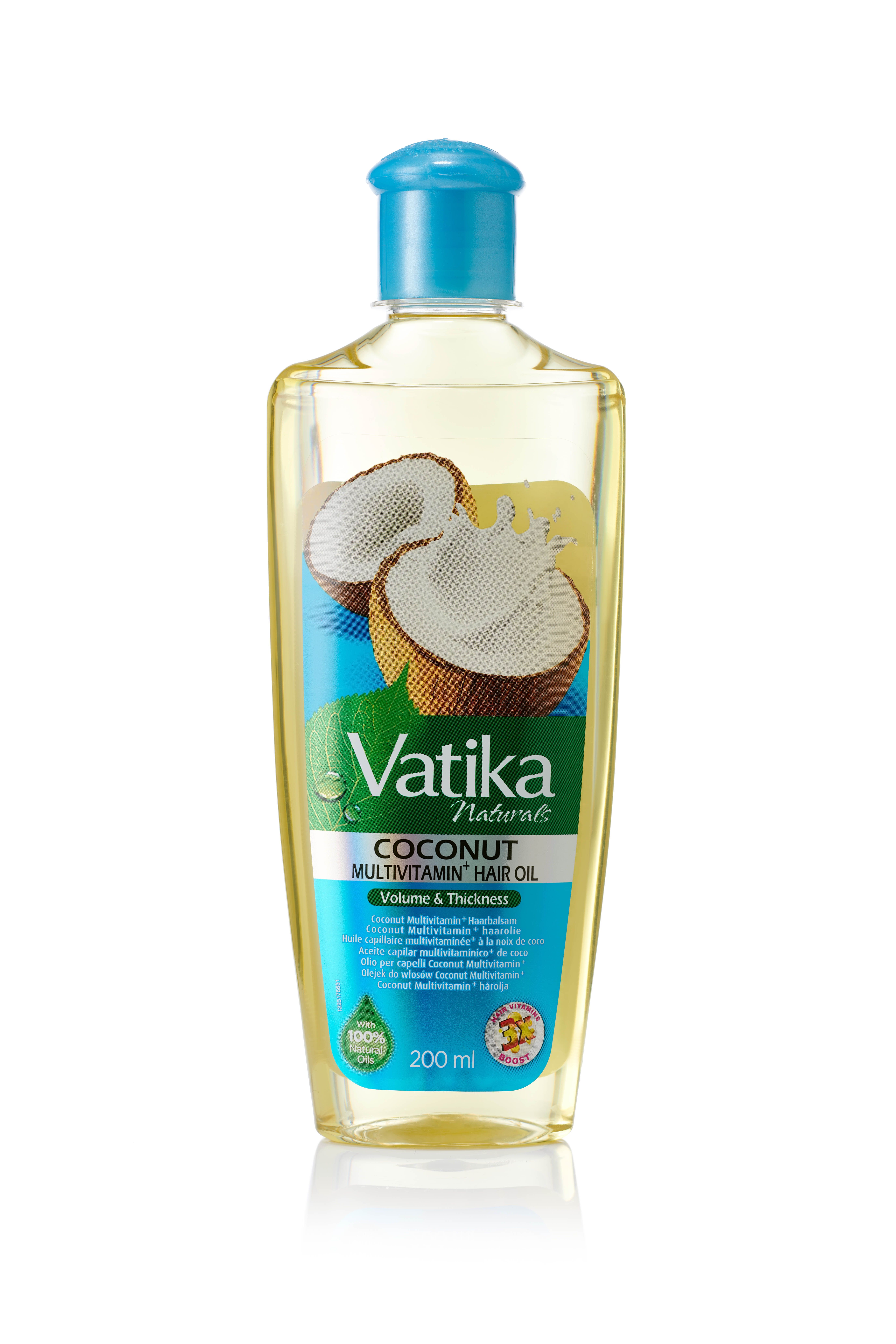 Vatika Naturals haarolie fles met blauwe dop. Opschrift: Coconut Multivitamin Hair Oil. Illustratie van kokosnoot. 200 ml.