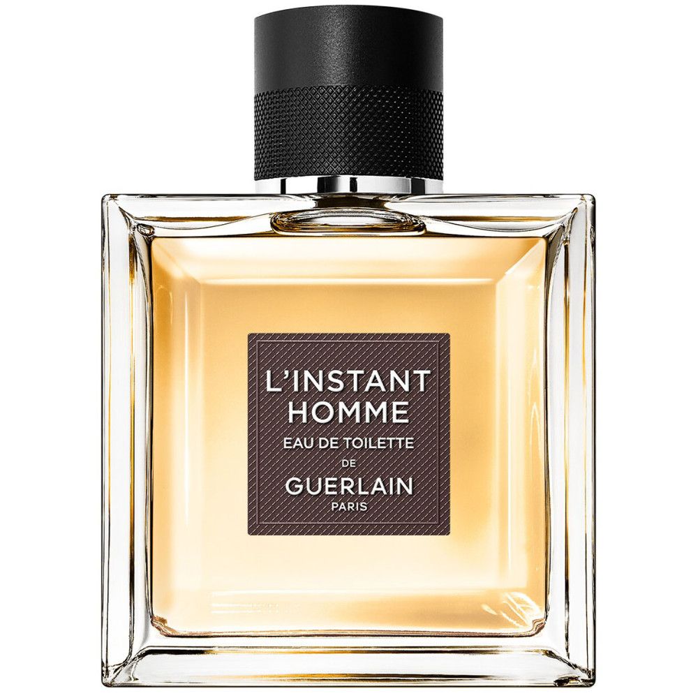 Guerlain l'Instant Homme Eau de Toilette fles. Vierkante glazen fles met bruin etiket en zwarte dop.