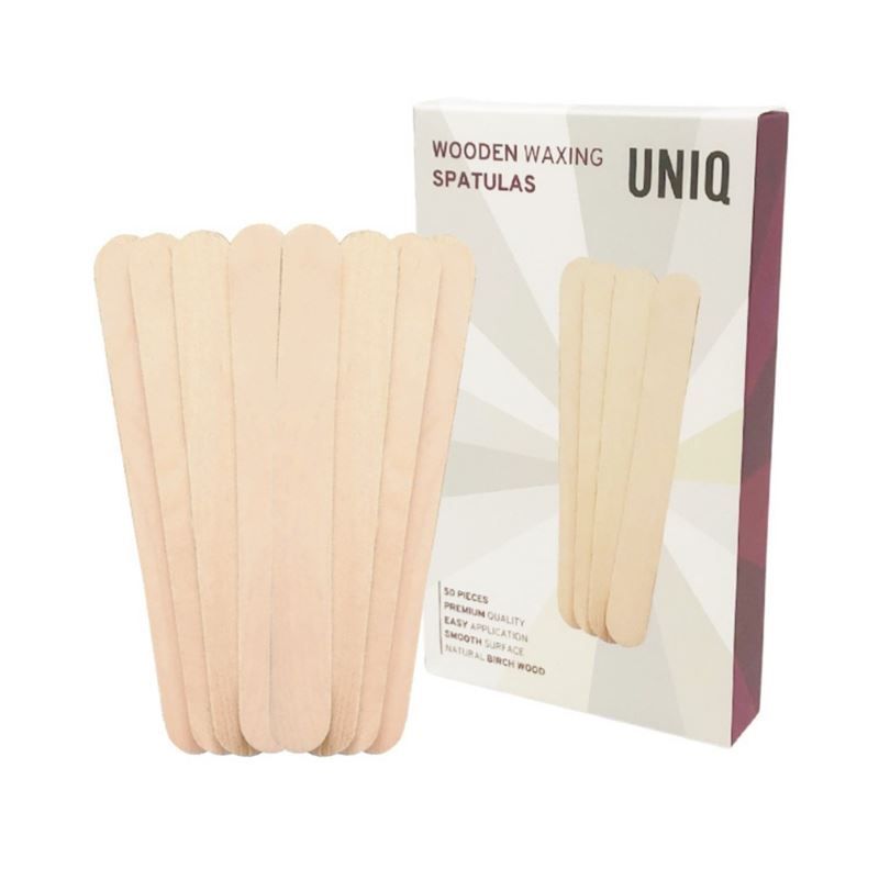 Verpakking en een stapel houten wax spatels.