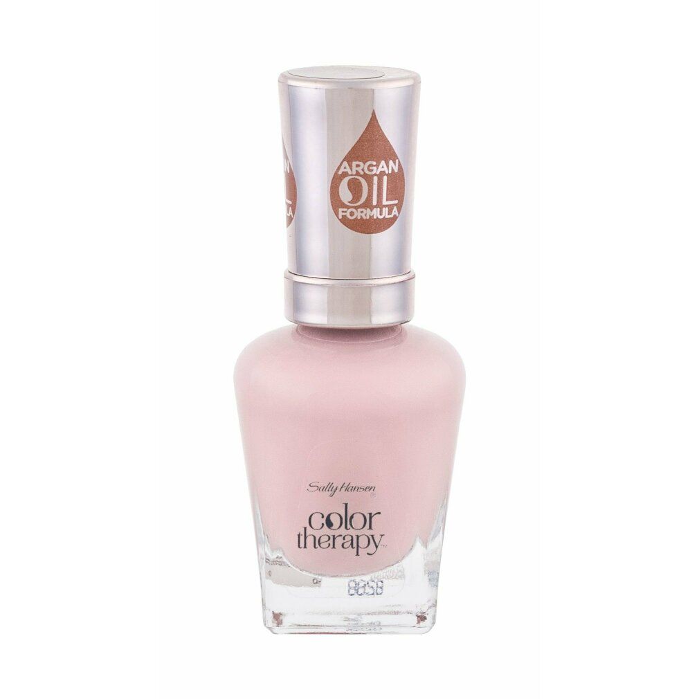 Flacon de vernis à ongles rose clair. Inscription: Sally Hansen Color Therapy. Bouchon avec logo formule à l'huile d'argan.