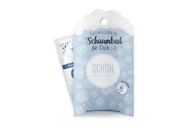 Sachet de bain moussant bleu clair avec motif de pissenlits. Texte : "Schaumbad für Dich :-)", "Schön, dass es Dich gibt".