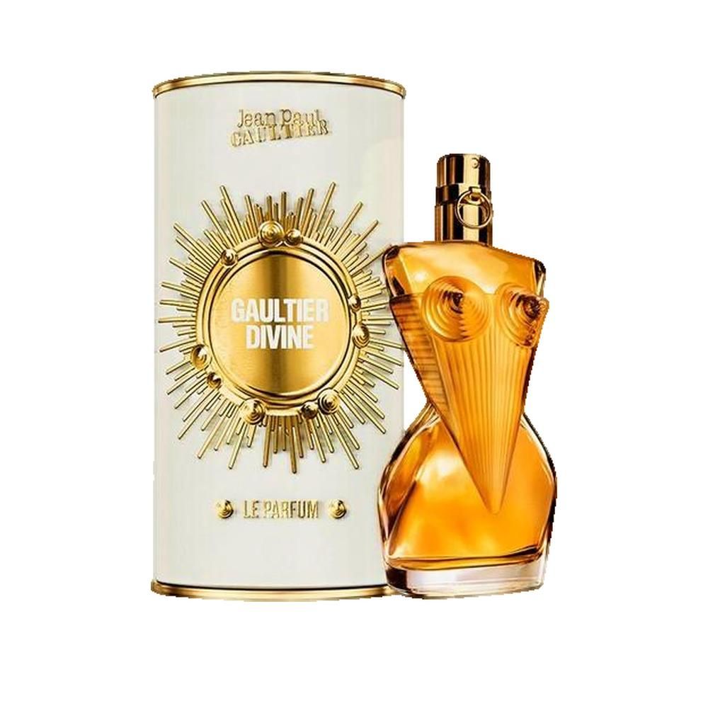 Parfumfles en verpakking. Fles in de vorm van een vrouwenlichaam. Goudkleurig glas, goudkleurige dop. Witte verpakking met gouden logo.