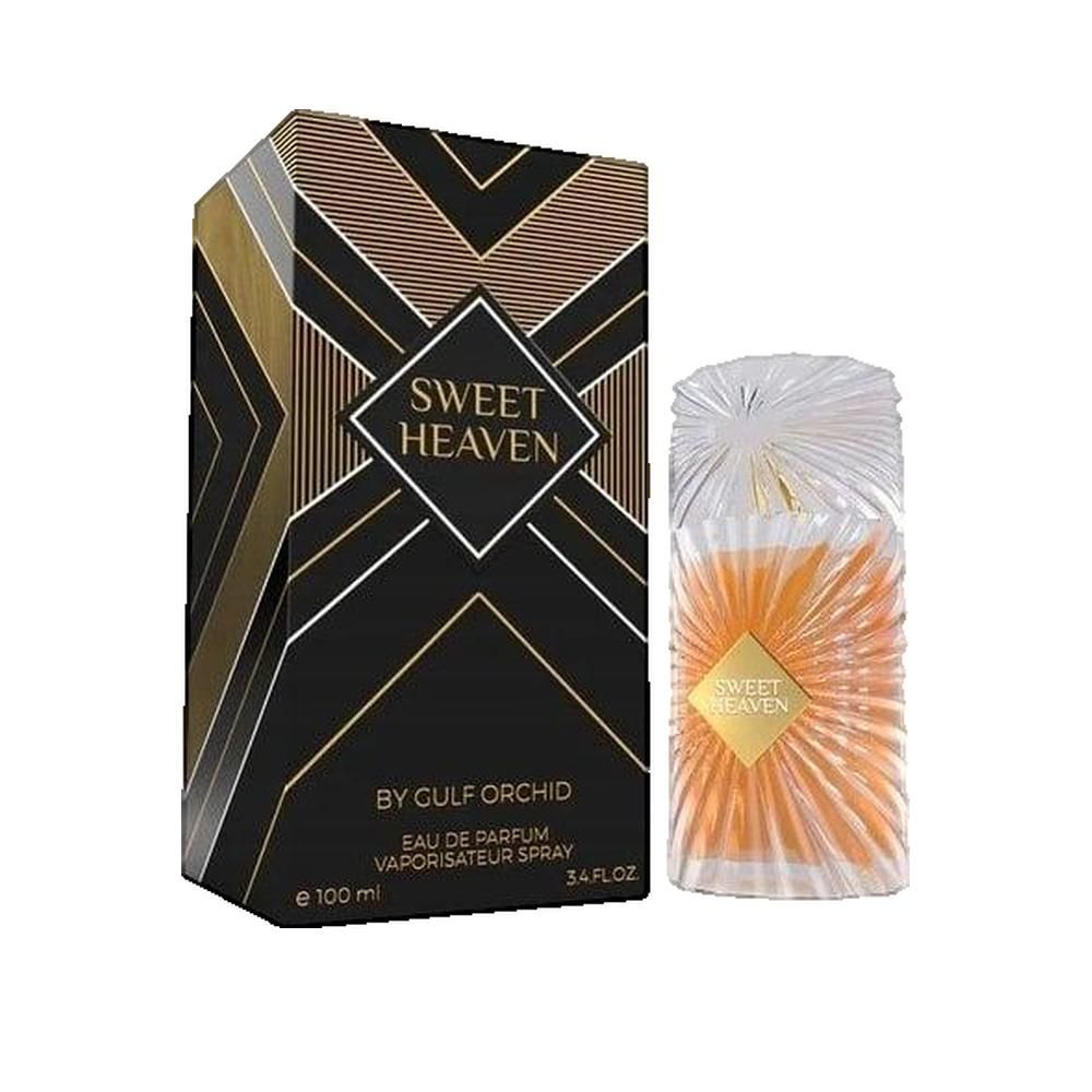 Flacon de parfum et boîte. Flacon avec liquide ambré, étiquette dorée. Boîte noire avec motifs géométriques dorés et texte.