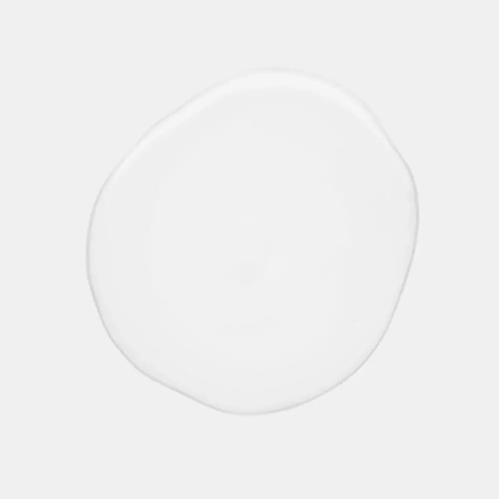 Cirkelvormige klodder van een transparante vloeistof. Geen opschrift zichtbaar.