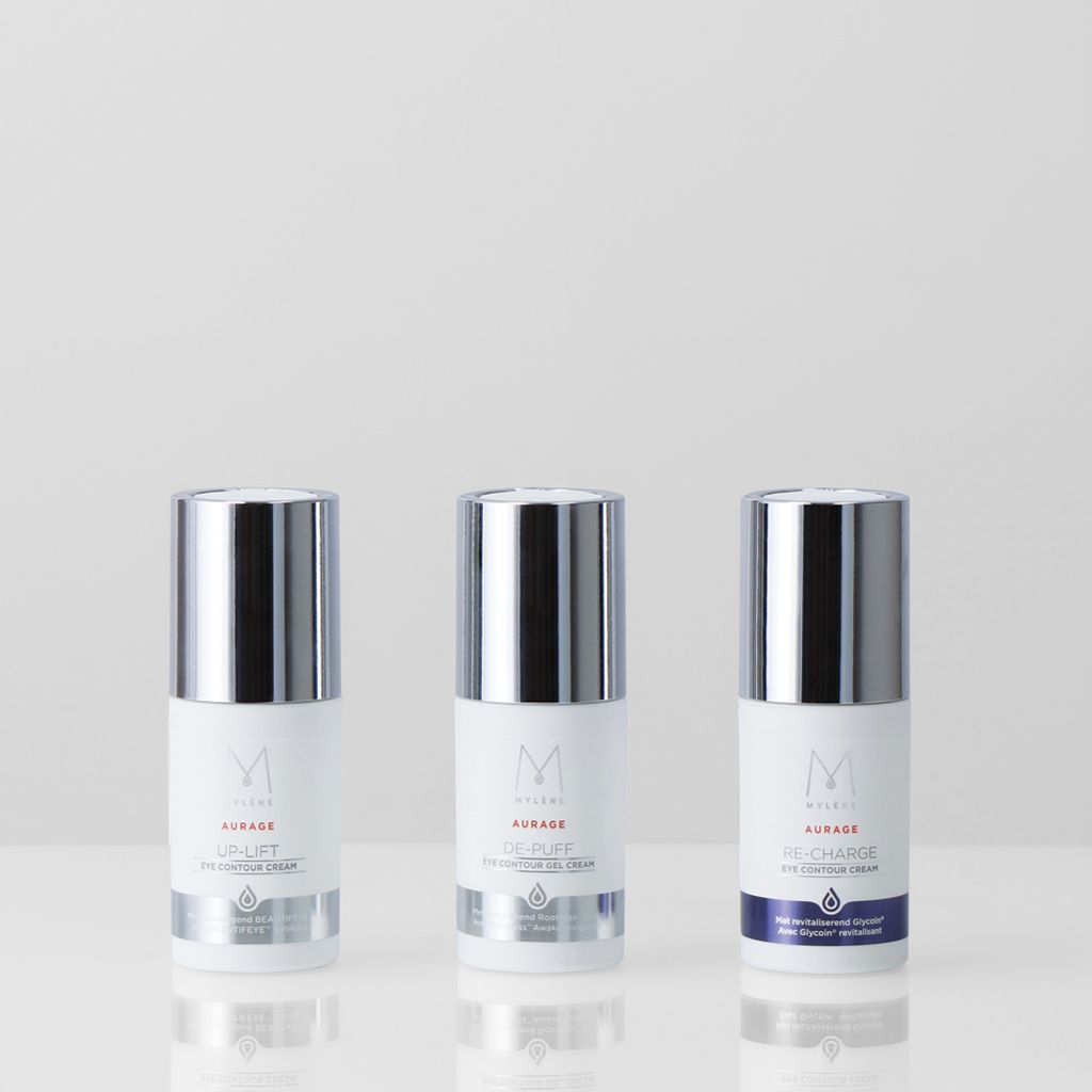Trois produits de soin Mylène : Uplift, Night Repair Plus et Re-Charge Eye Contour Cream dans des flacons blancs avec capuchons argentés.