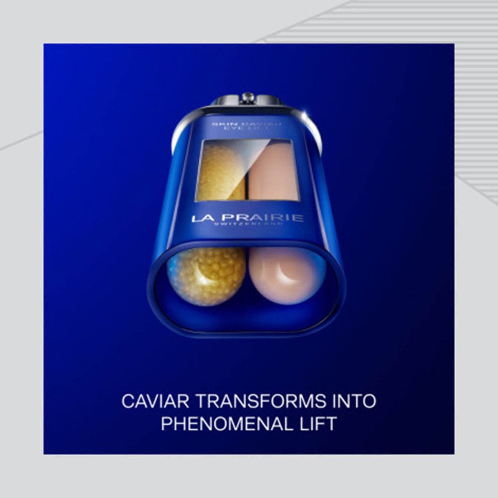 Sérum La Prairie Skin Caviar Eye Lift. Récipient bleu avec fermeture argentée, montrant des perles de caviar jaunes et une texture crémeuse.