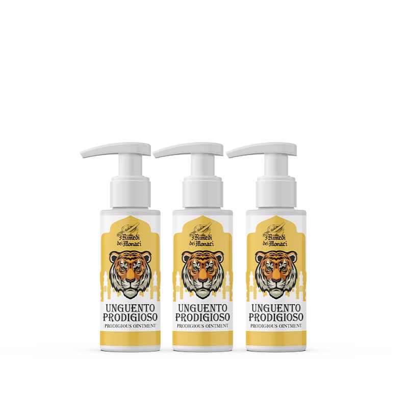 Drie flessen met pompdosering. Op elke fles staat "Unguento Prodigioso". Etiketten met illustratie van een tijgerkop.