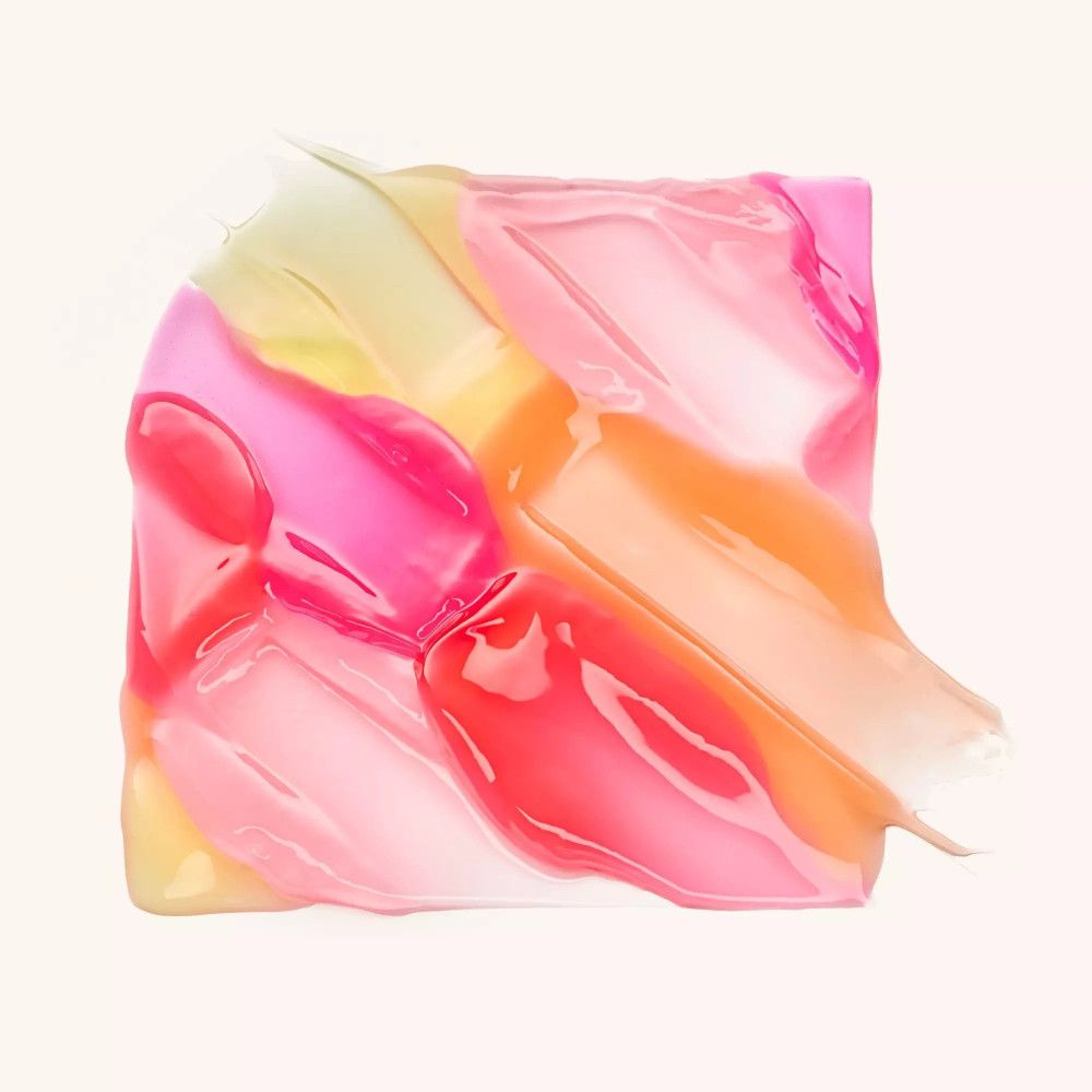 Verschillende tinten lipolie. Roze, oranje en geel. Op lichte achtergrond.