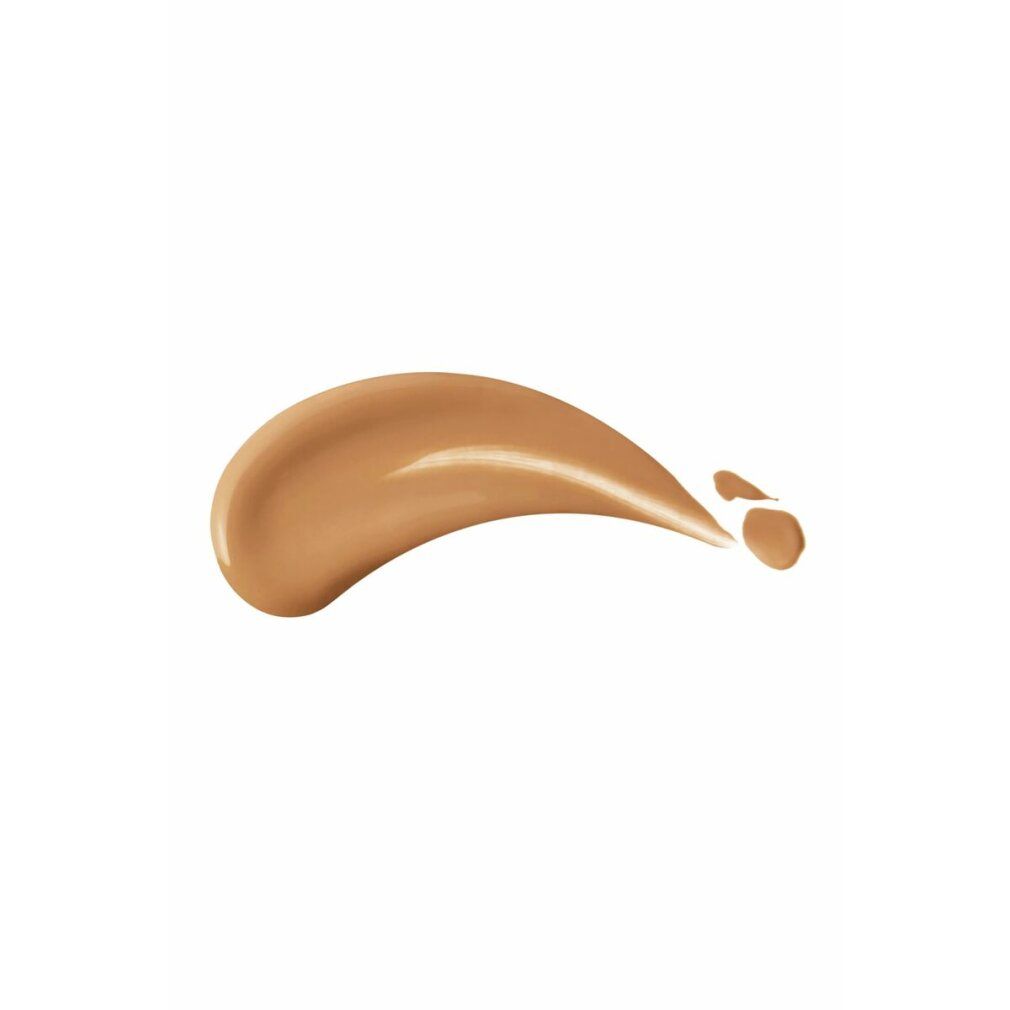 Goutte de fond de teint de teinte marron. Sur fond blanc.