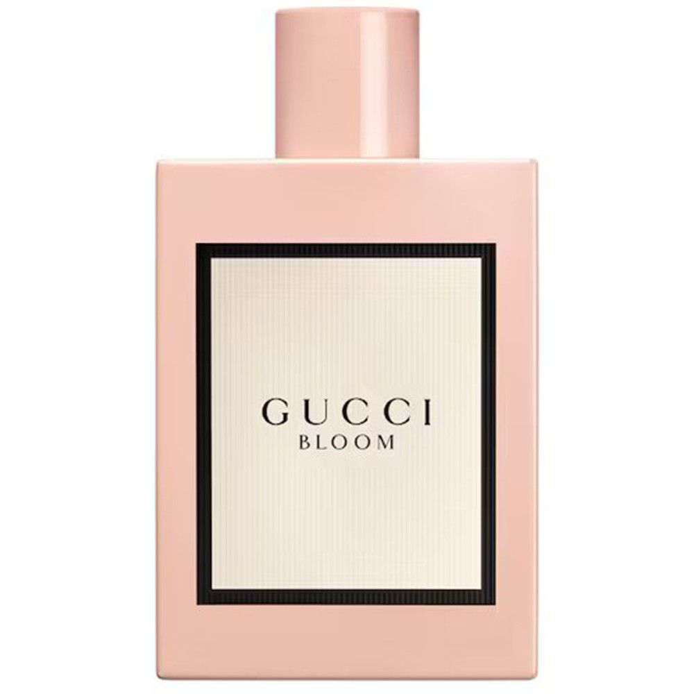 Roze fles met wit etiket en zwarte rand. Op het etiket: Gucci Bloom. Roze dop.