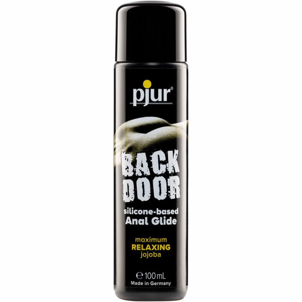 Zwarte fles met geel logo. Opschrift: BACK DOOR Relaxing Silicone Anal Glide. Met jojoba. 100 ml. Gemaakt in Duitsland.