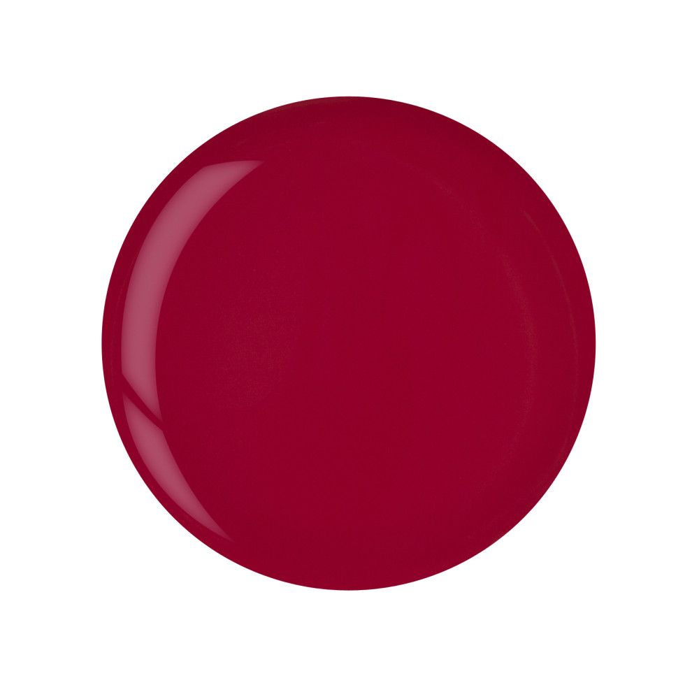 Tache ronde et brillante de vernis à ongles rouge foncé. Aucun autre détail visible.
