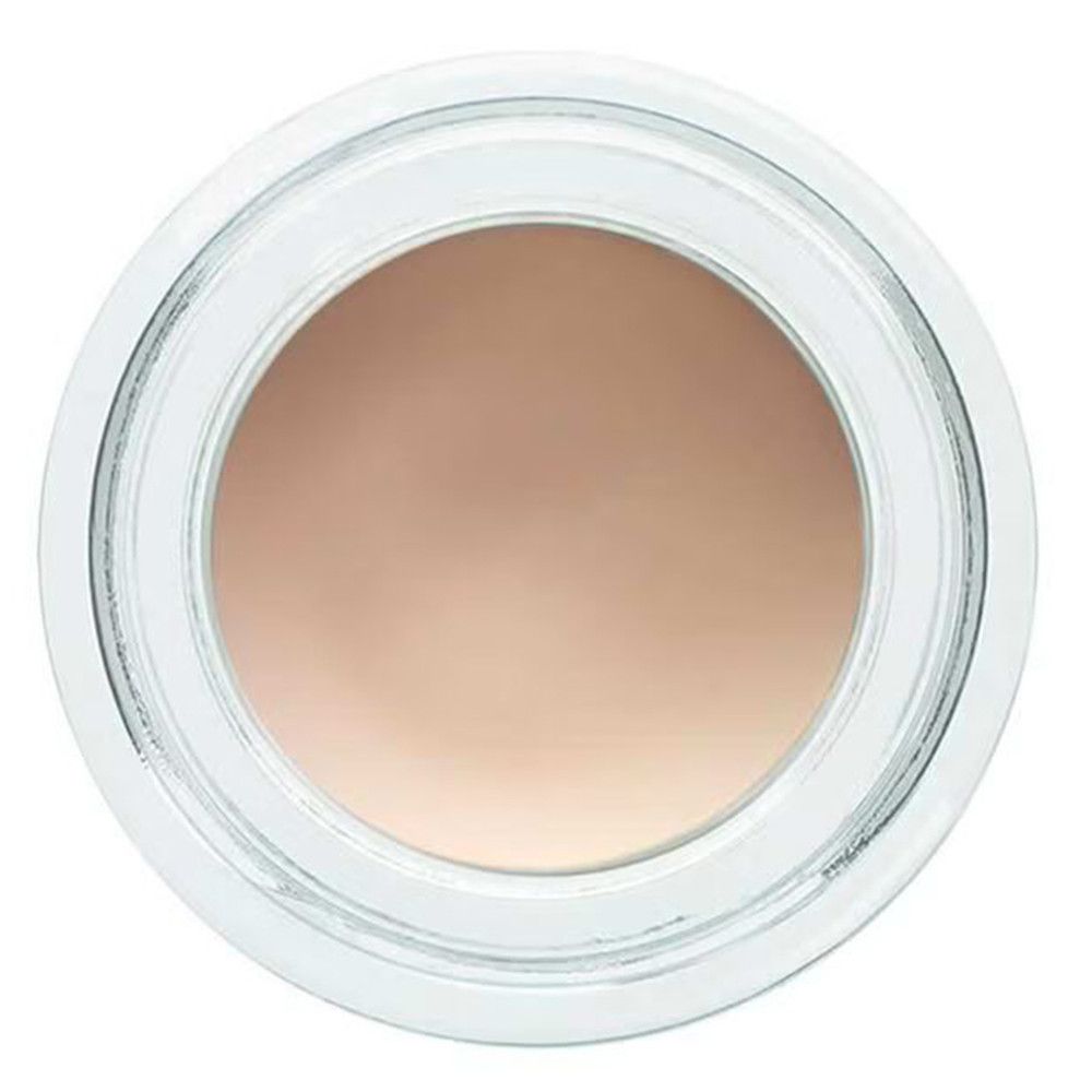 Bovenaanzicht van een ronde pot met beige inhoud. De pot is van transparant glas.