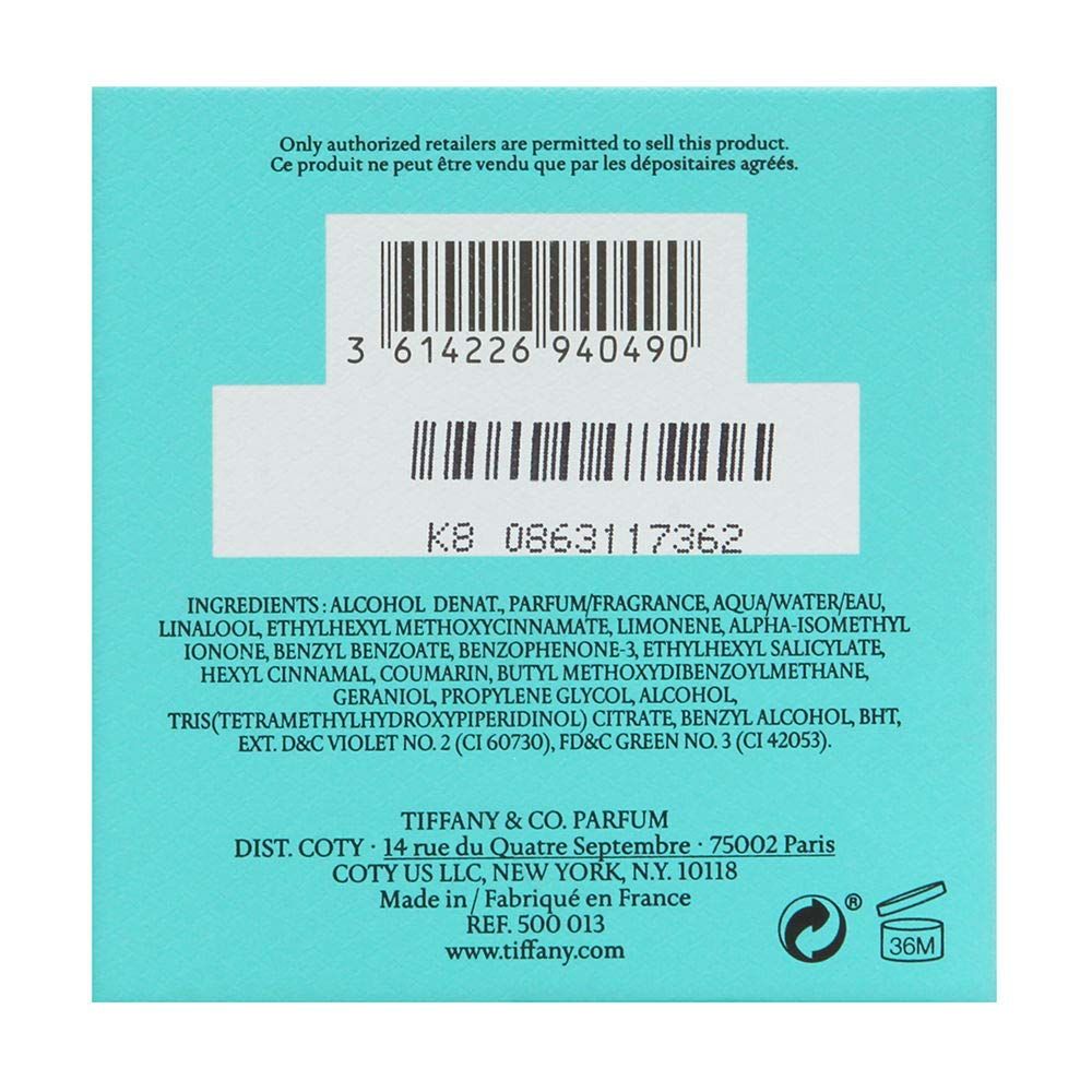 Dos de la boîte turquoise. Code-barres, ingrédients, informations du fabricant et symbole de recyclage.