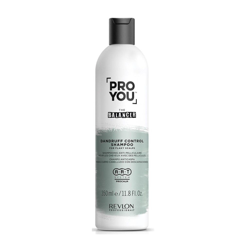 Flacon de shampooing blanc avec bouchon noir. Inscription : PRO YOU THE BALANCER, Dandruff Control Shampoo. Marque : Revlon.