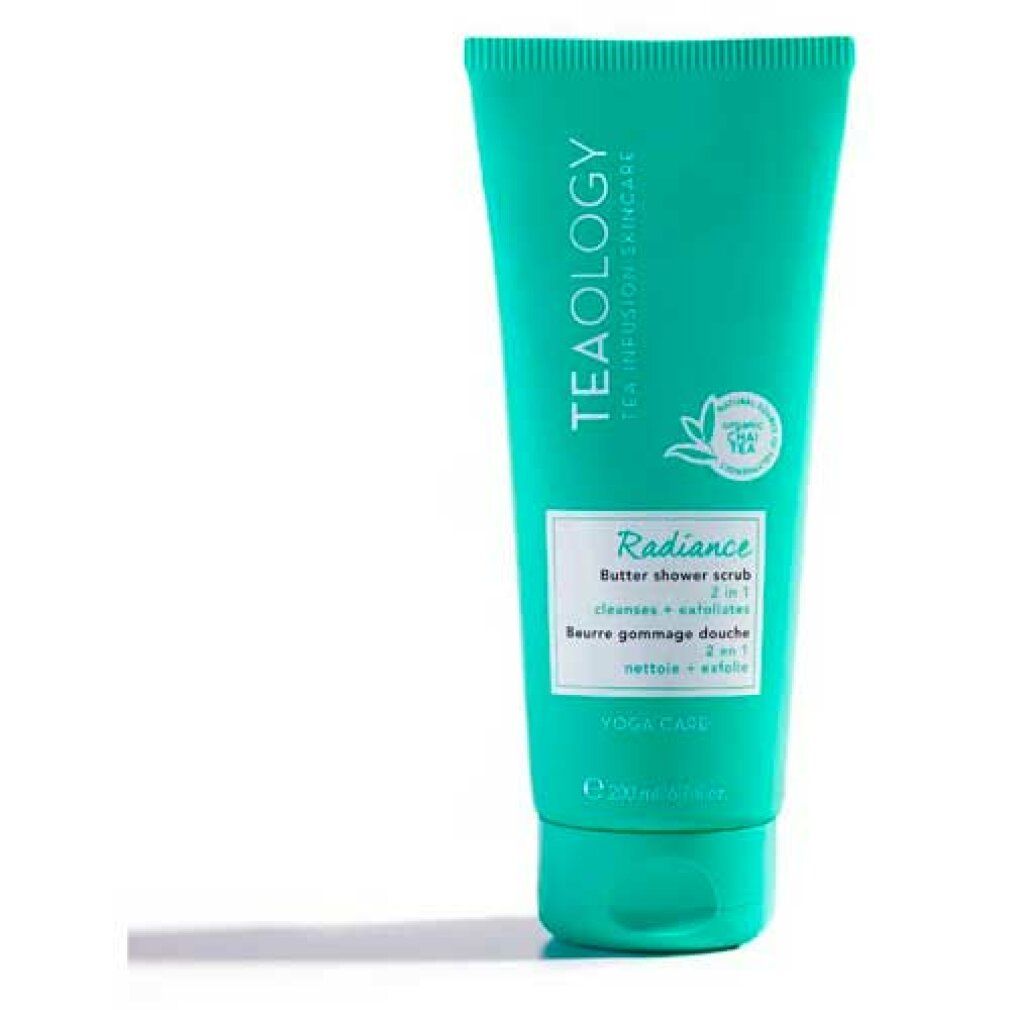 Turquoise tube met wit etiket. Opschrift: Radiance Butter Shower Scrub, 2 in 1. Merk: Teaology.