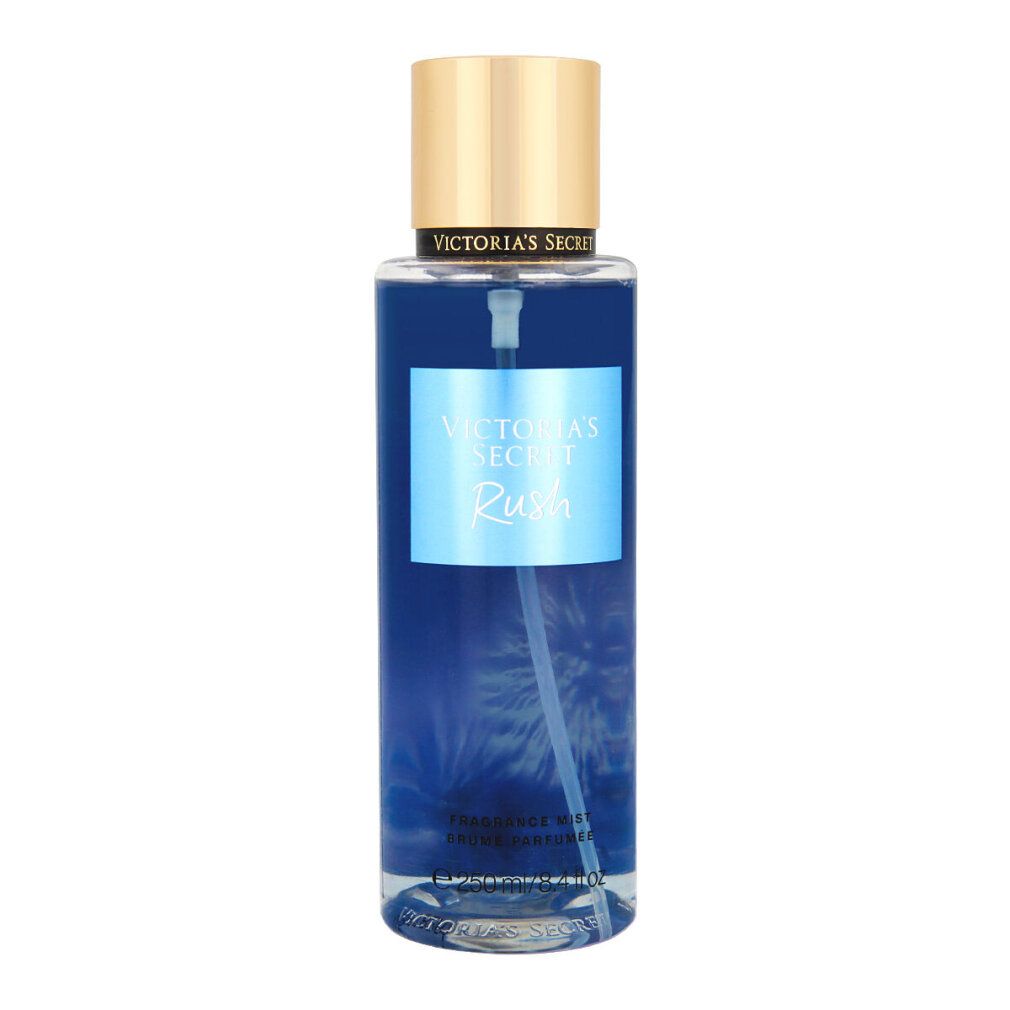 Brume parfumée Rush de Victoria's Secret. Liquide bleu dans flacon cylindrique, bouchon doré. Étiquette produit.