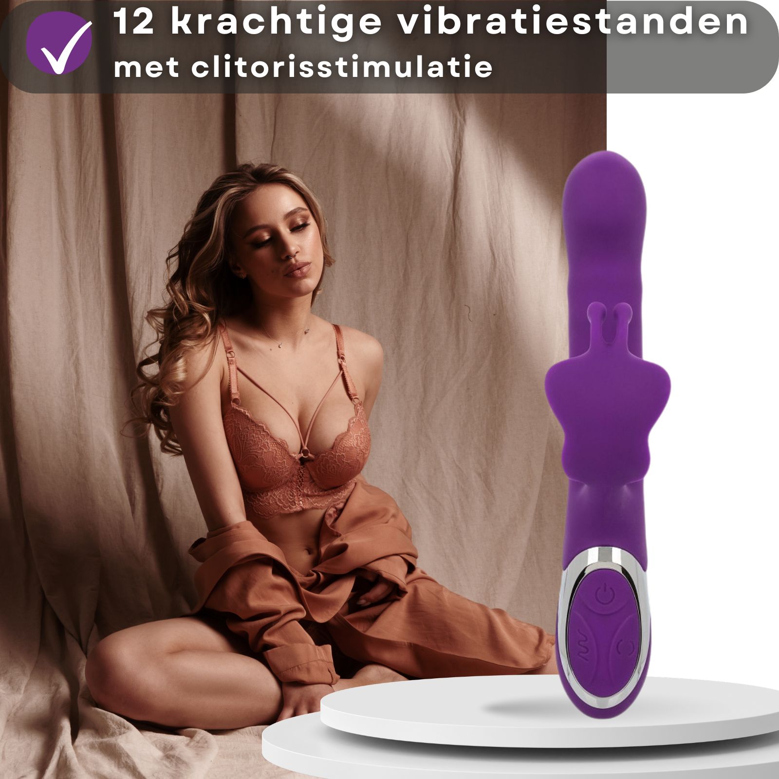 Paarse vibrator met tekst. Tekst: Oplaadbaar, gebruiksduur tot 55 minuten. USB-kabel.