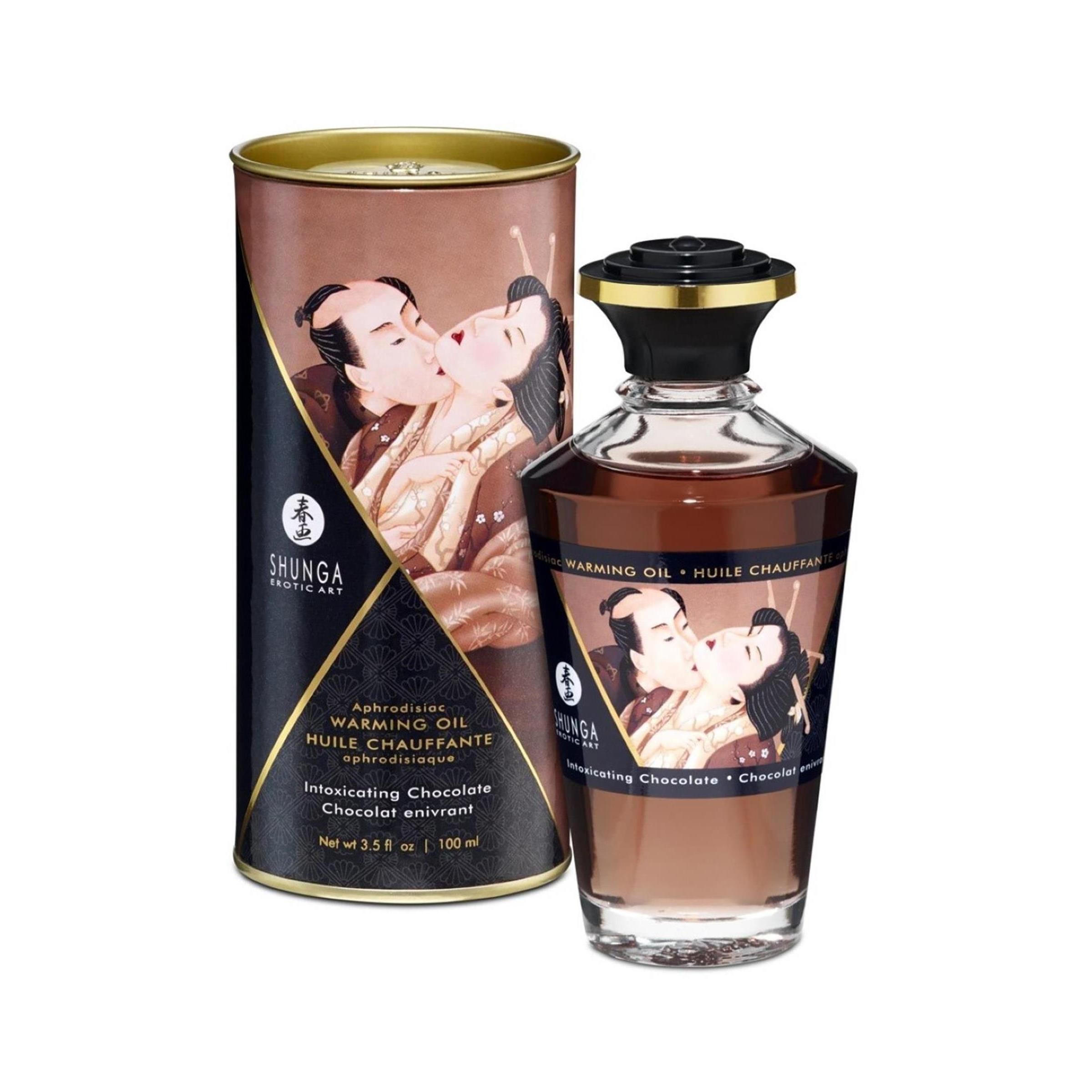 Fles en doos. Opschrift: Shunga, Warming Oil, Intoxicating Chocolate. Afbeelding van een paar.