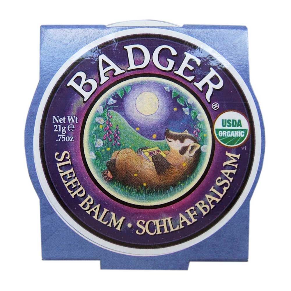 Pot rond avec couvercle. Inscription : BADGER, SLEEP BALM, SCHLAFBALSAM. Label USDA Organic. Illustration d'un blaireau sous la lune.