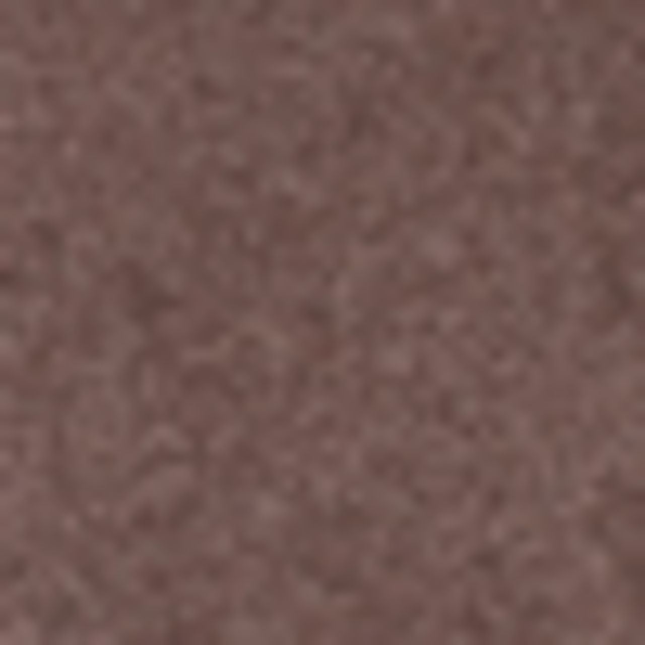 Close-up van een bruine, glinsterende oogschaduw. De textuur is fijn en licht glanzend.