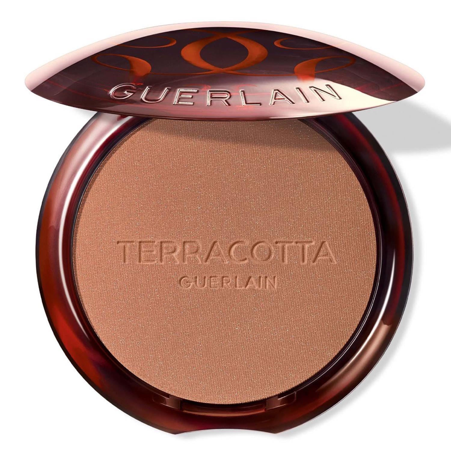 Poudre compacte Terracotta Guerlain. Boîtier rond marron ouvert. Poudre bronzante visible.