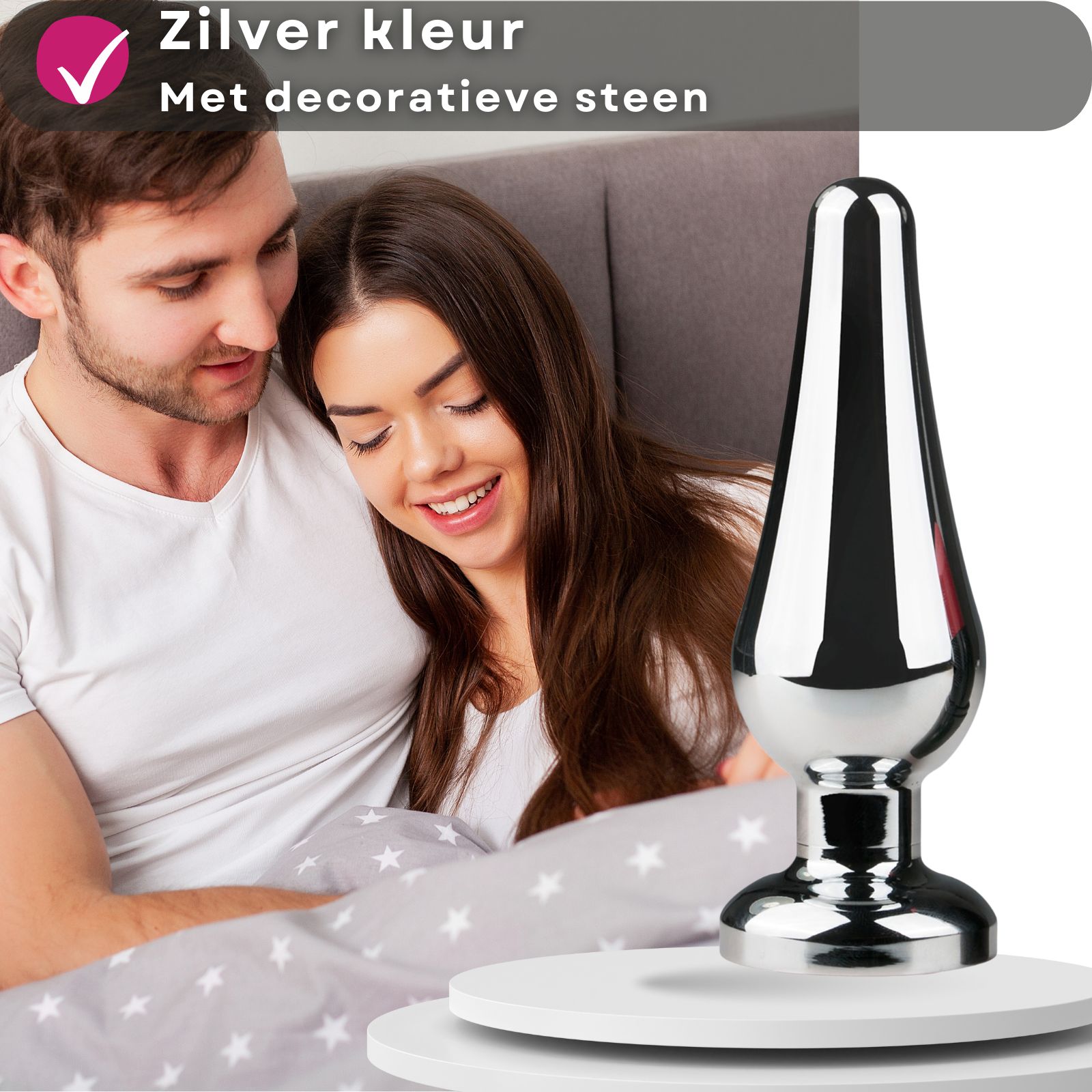 Kegelvormige metalen anale plug met roze siersteen. Zilverkleurig.