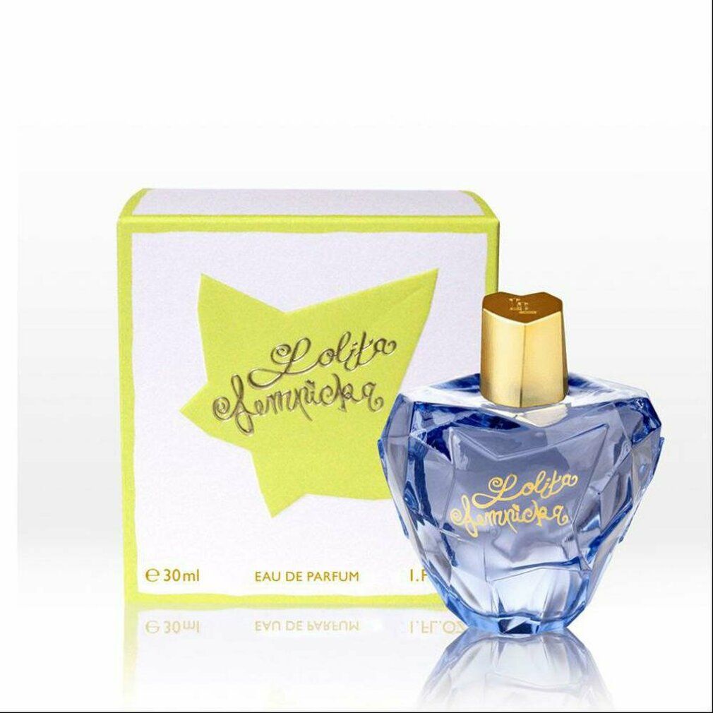 Blauwe fles en doos. Opschrift "Lolita Lempicka". Doos met sterpatroon en tekst.