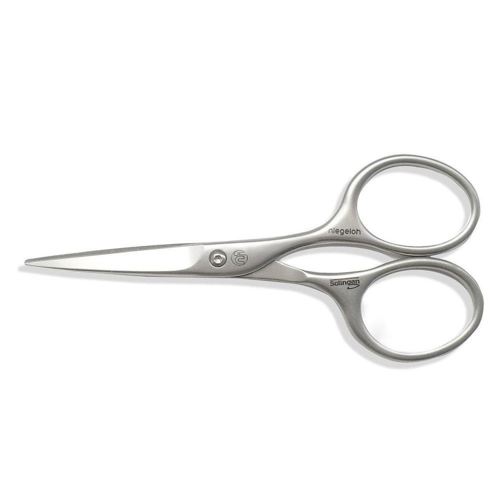 Zilveren Niegeloh Solingen baardschaar. Metaal, gebogen handgrepen, puntige bladen. Merknaam en logo zichtbaar.