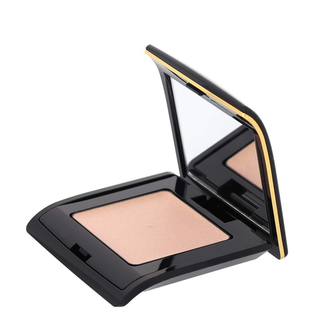 Poudre compacte noire avec bord doré. Ouverte avec miroir. La poudre est beige clair.