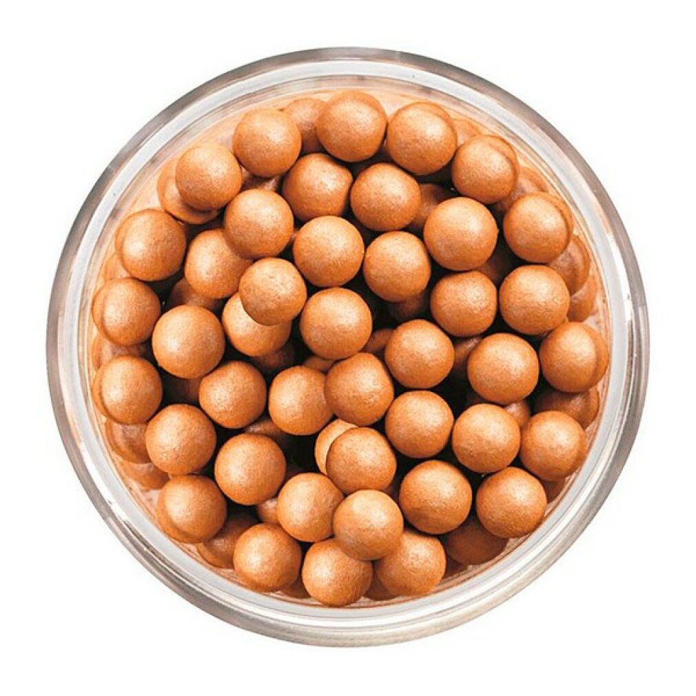 Perles rondes, couleur bronze, dans un récipient en verre transparent. Vue de dessus.