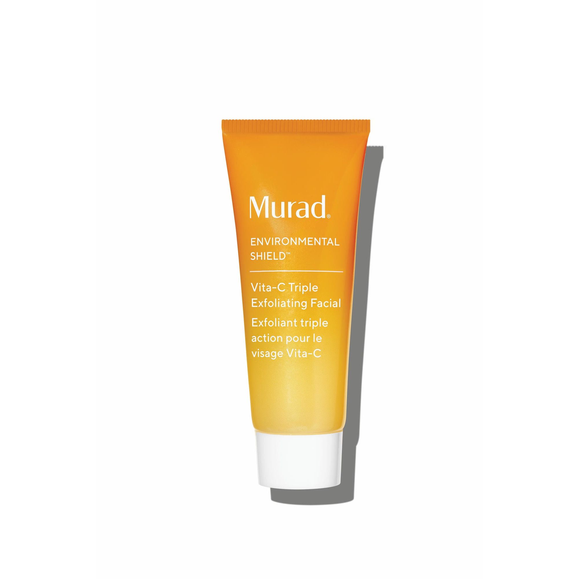 Oranje tube met witte dop. Tekst: Murad, Vita-C Triple Exfoliating Facial. Franse tekst.