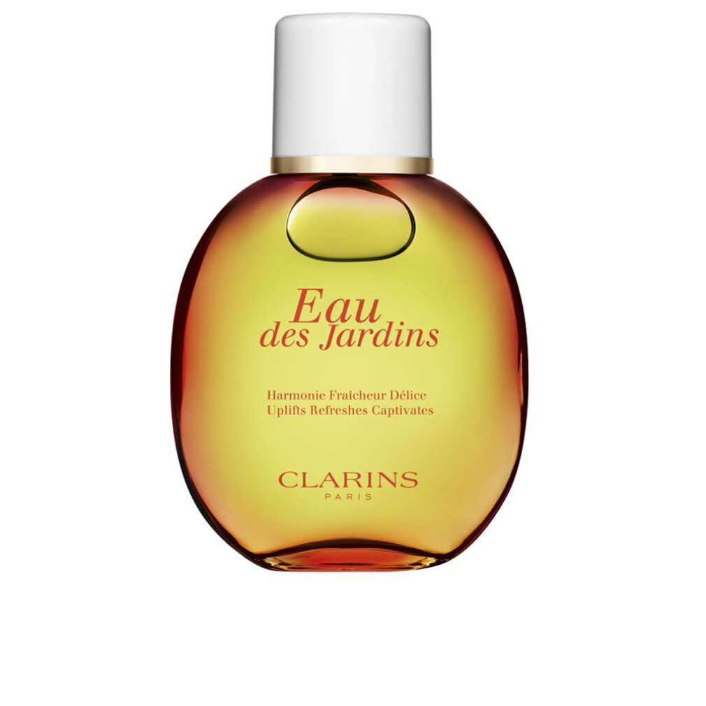 Ronde flacon met witte dop. Opschrift: Eau des Jardins. Kleurovergang van geel naar rood. Clarins Paris.