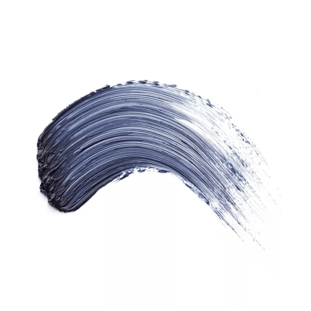 Trait de mascara noir sur fond blanc. Texture visible.