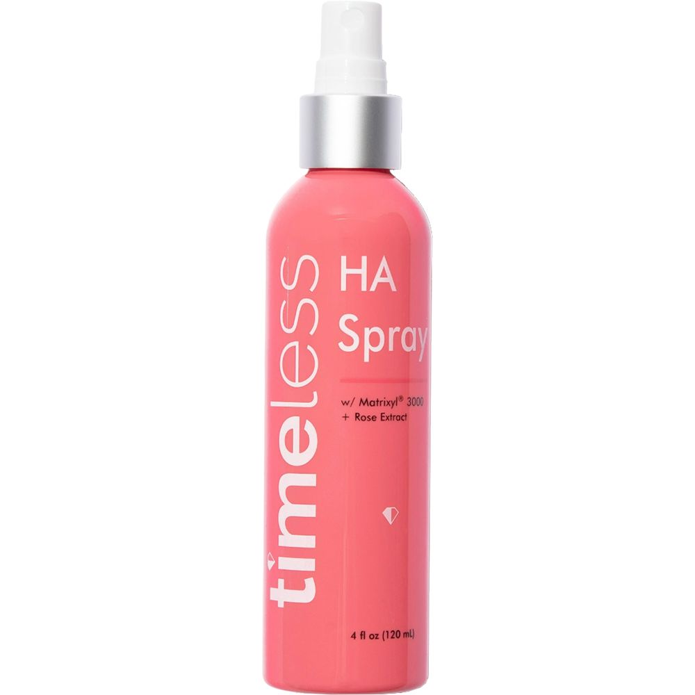Roze sprayfles met witte sproeikop. Opschrift: timeless, HA Spray, Matrixyl 3000, Rose Extract. 4 fl oz (120 ml).