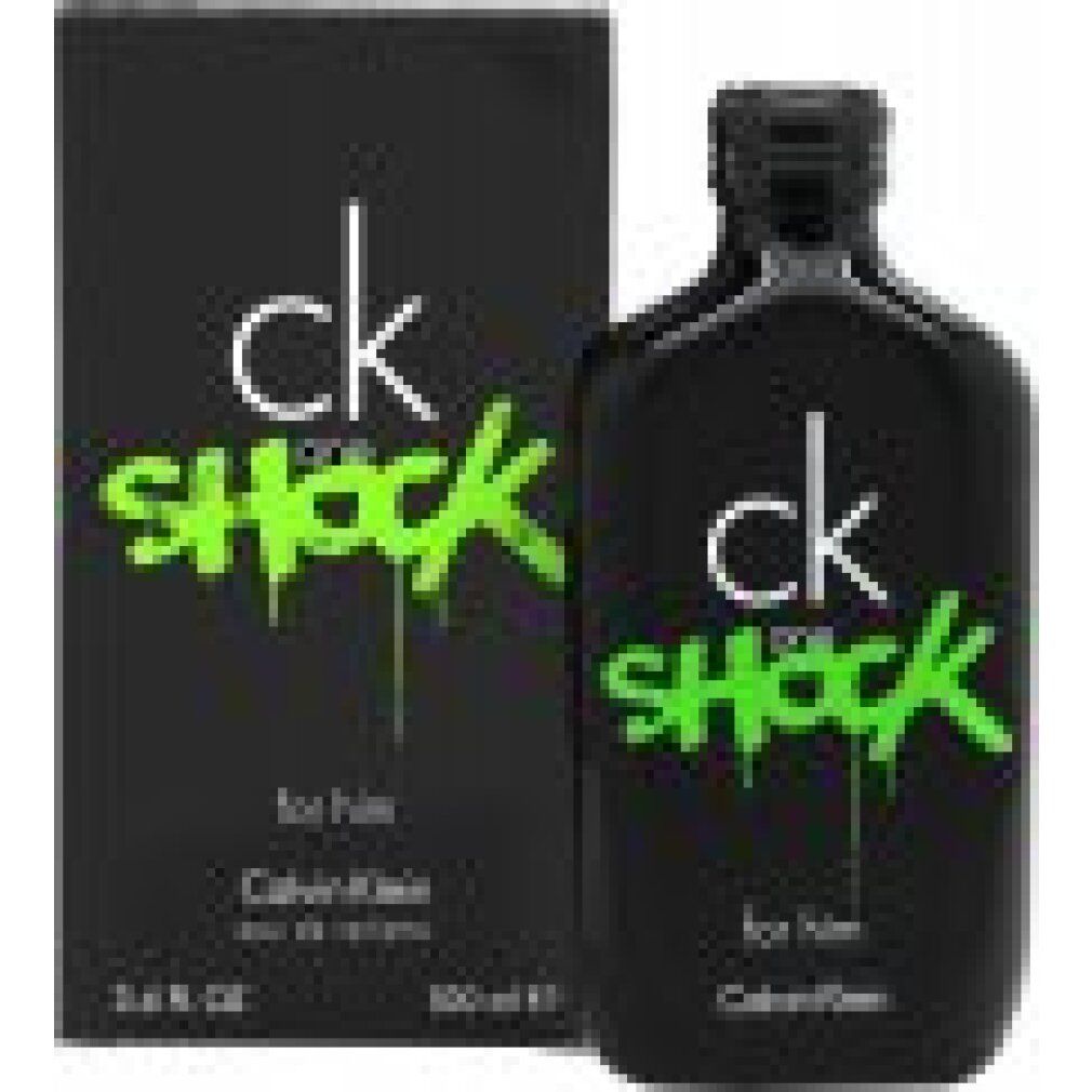 Zwarte fles en verpakking met groene tekst "ck one SHOCK". "Calvin Klein" en "for him" zijn ook zichtbaar.
